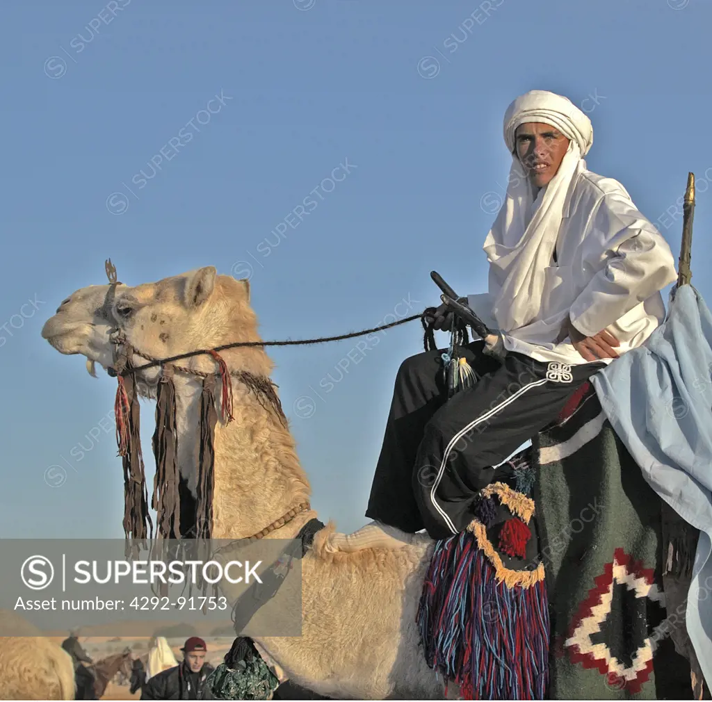 Tunisia, Douz oasis area, berber camel driver