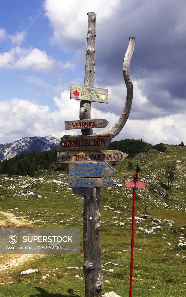 Slovenia, Gorenjska Region, Julian Alps, Velika Planina: sign on wooden post