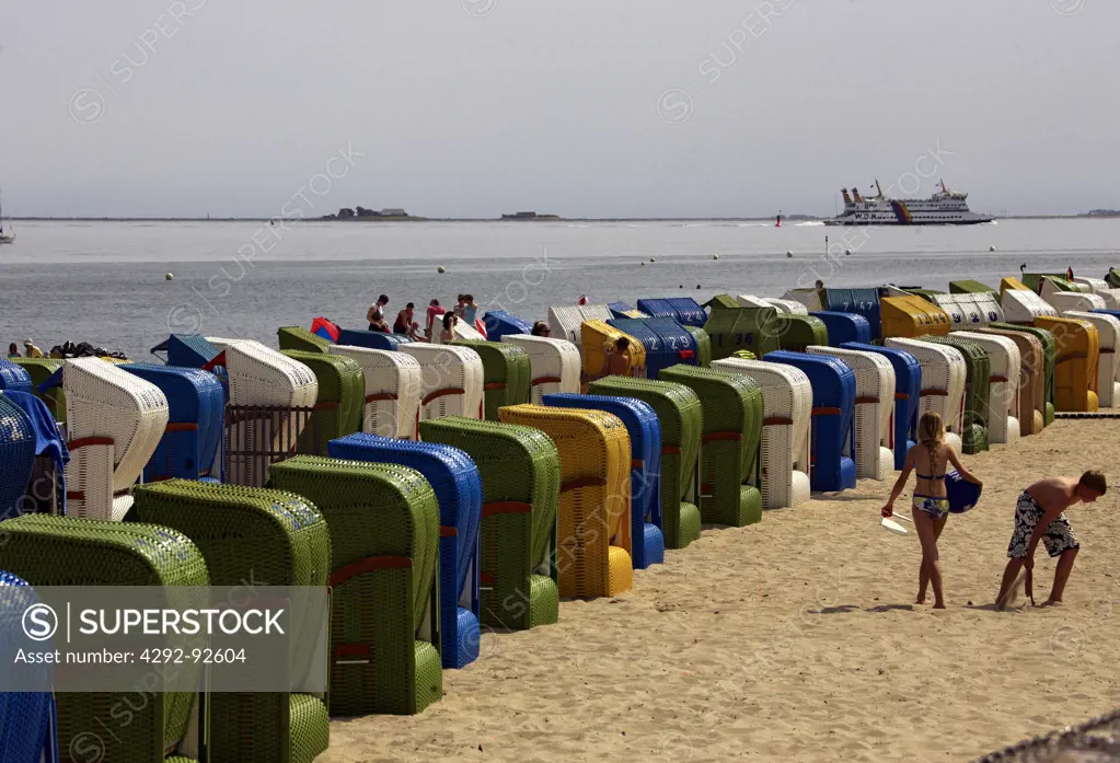 Germany, North Sea, Schleswig-Holstein, Fohr island, Nieblum city. People on a beach during the holiday season,
