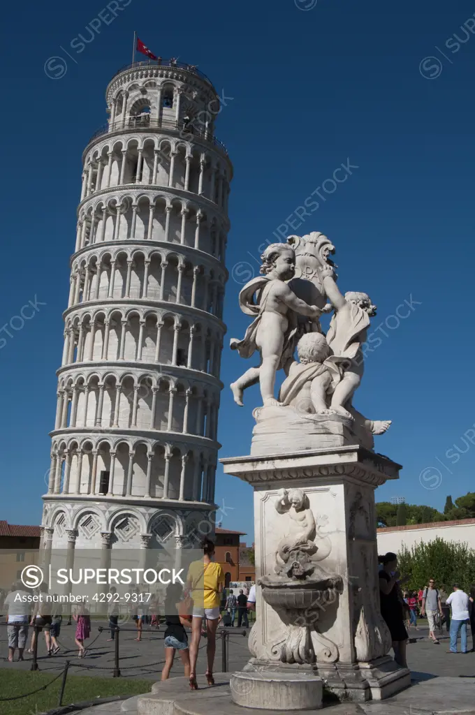 Italy, Tuscany, Pisa, Piazza Dei Miracoli, Fontana dei Putti, Fountain and Leaning Tower at Sunset