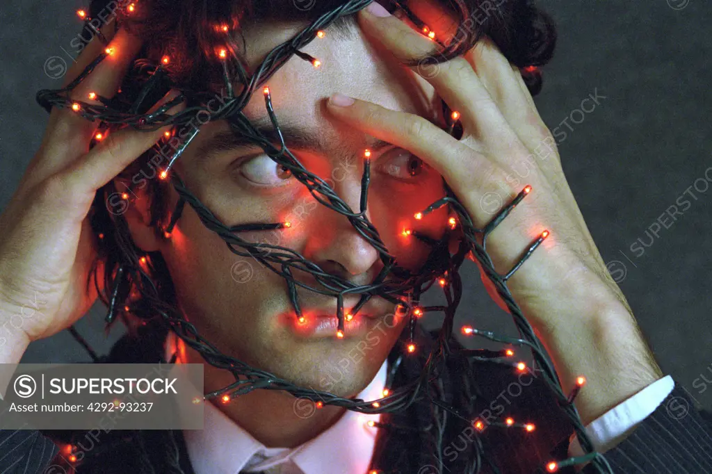 Strand of lights of man's face
