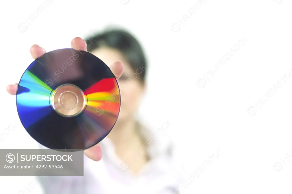 Close-up of a woman holding a CD