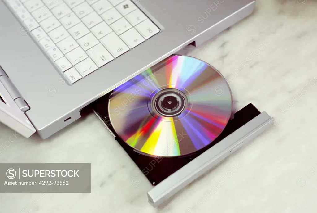 A cd ejecting out of a laptop