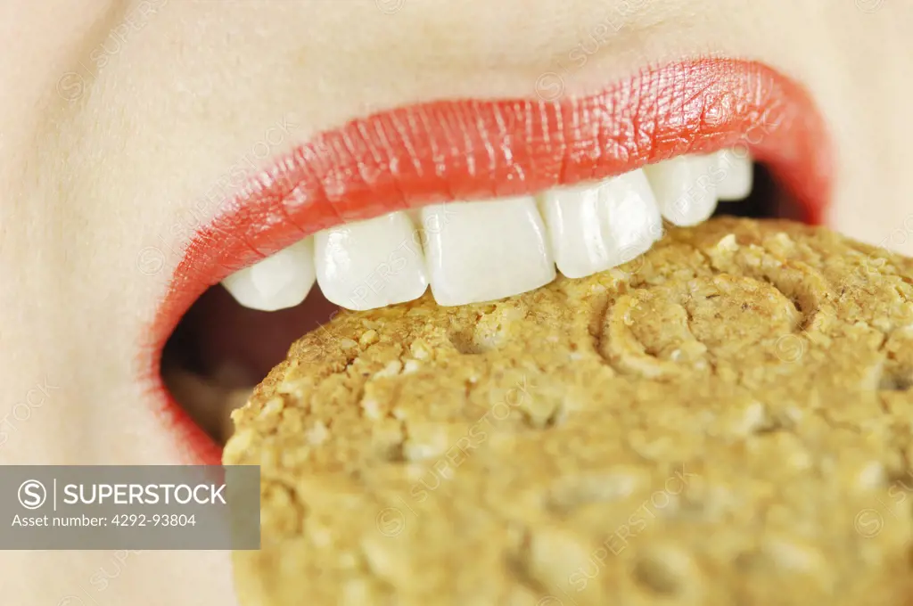 Woman Eating a Biscuit