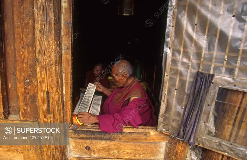 Eastern Tibet, Langmusi monastery. Reading the tibetan book