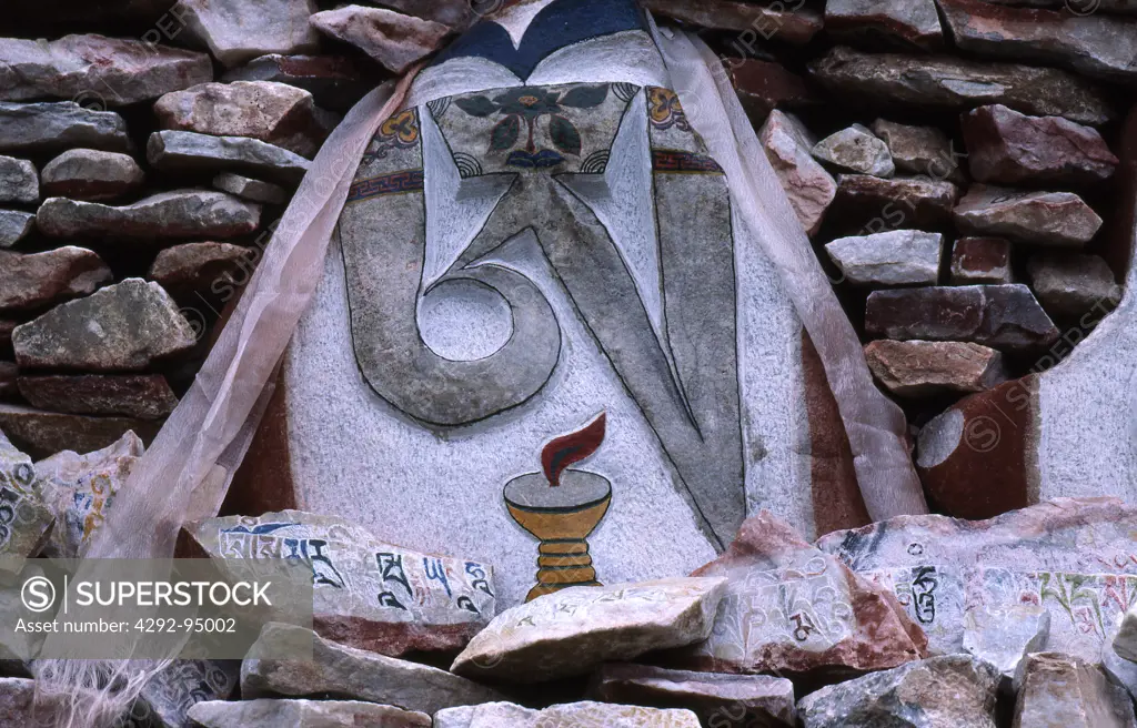 Eastern Tibet. Mani stones (prayer stones). Stones painted or engraved with buddhist images and mantra