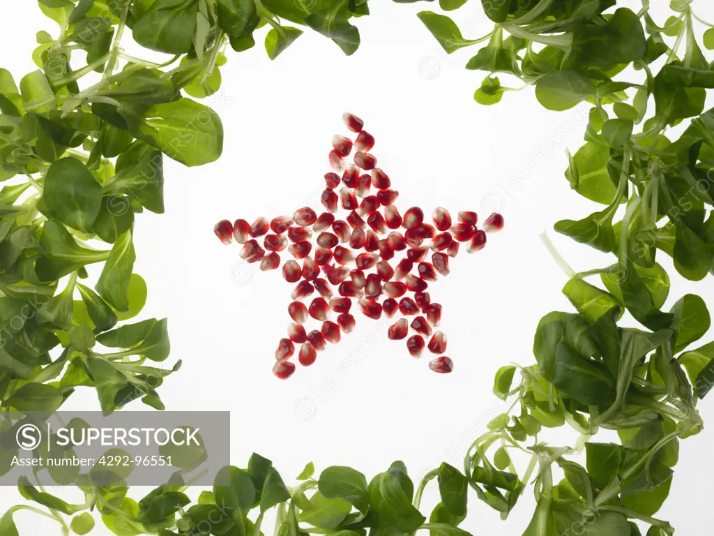 Star shaped pomegranate seeds and salad