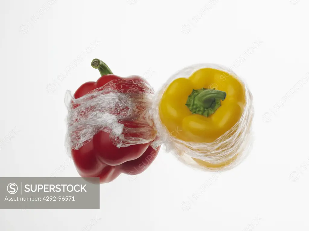 Red and yellow peppers in Cellophane