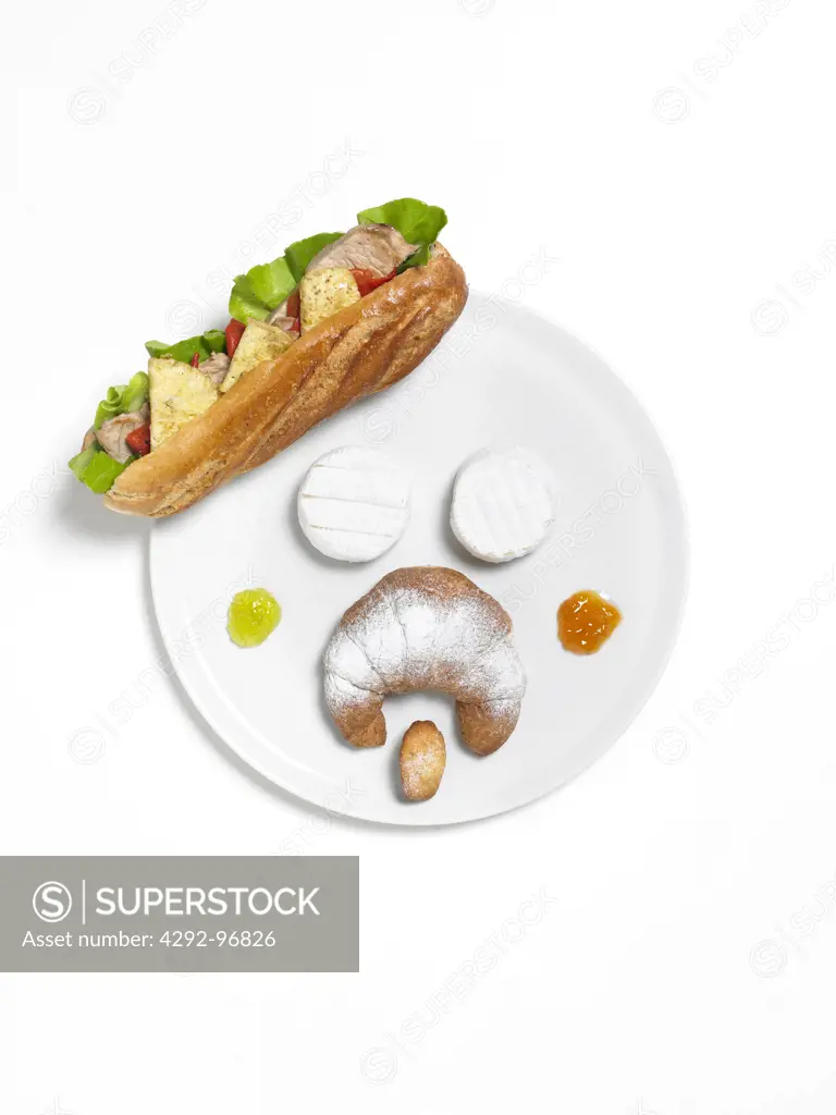 Typical french food on dish shaped as human face