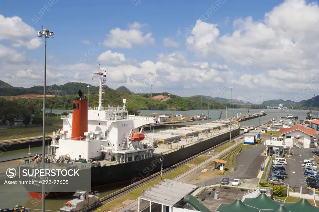 A ship waiting to leave Miraflores Locks towards Pedro Miguel Locks. Centenial Bridge can be seen in the background. Panama City, Republic of Panama, Central America