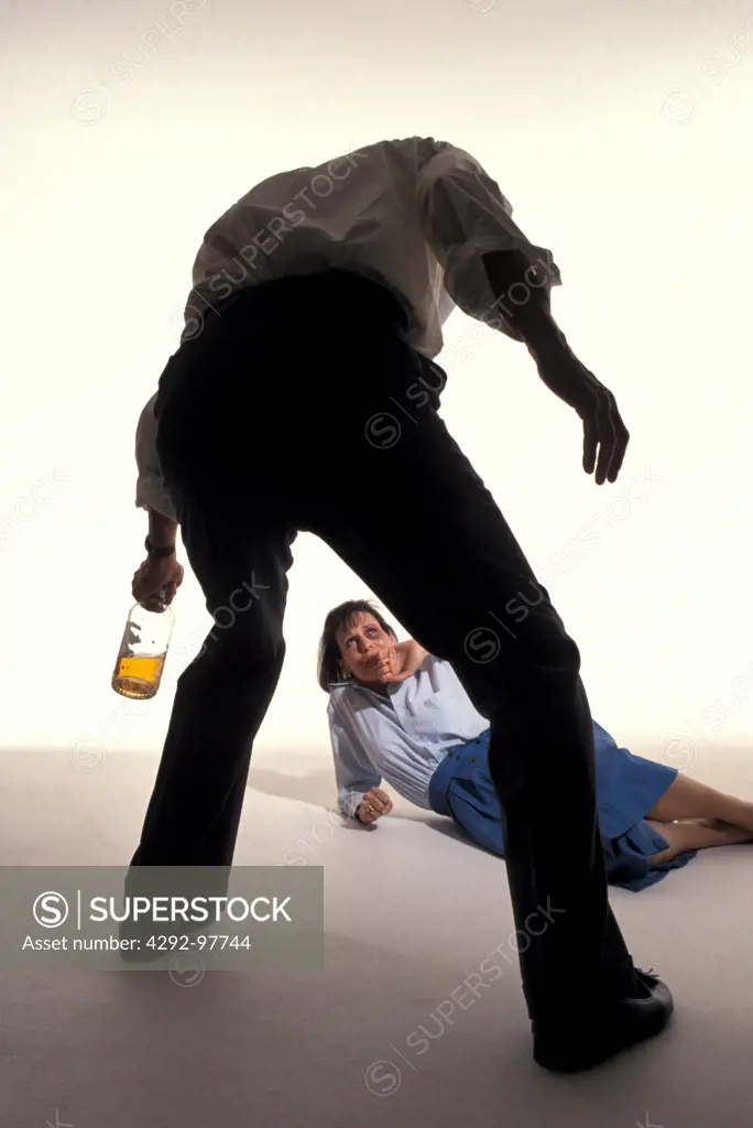 Alcoholism: man abusing woman