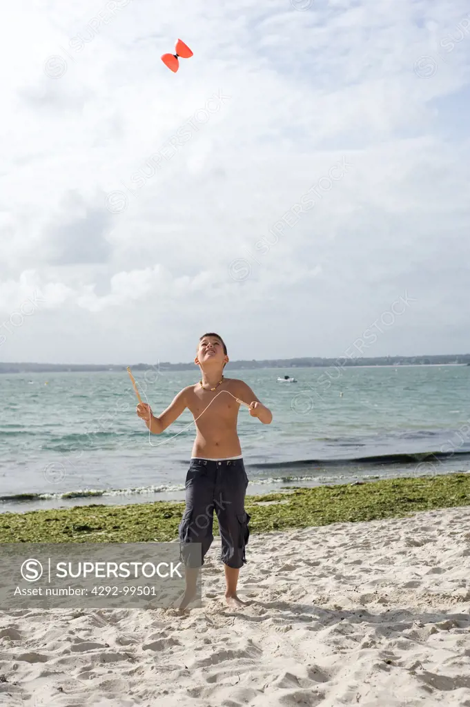 Boy playing on beach