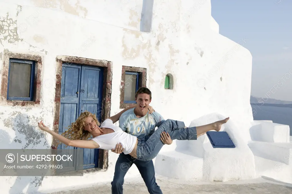 Playful couple in Santorini, Greece
