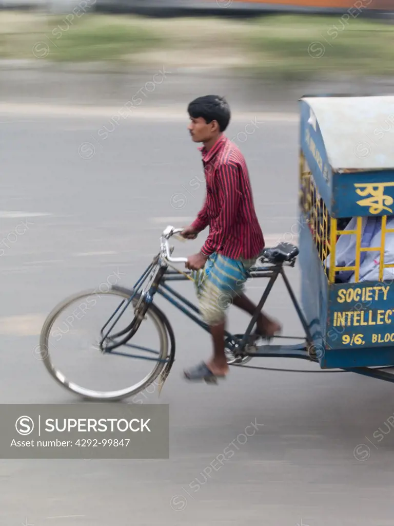 Bicycle rickshaw drivers at work in Dhaka, Bangladesh