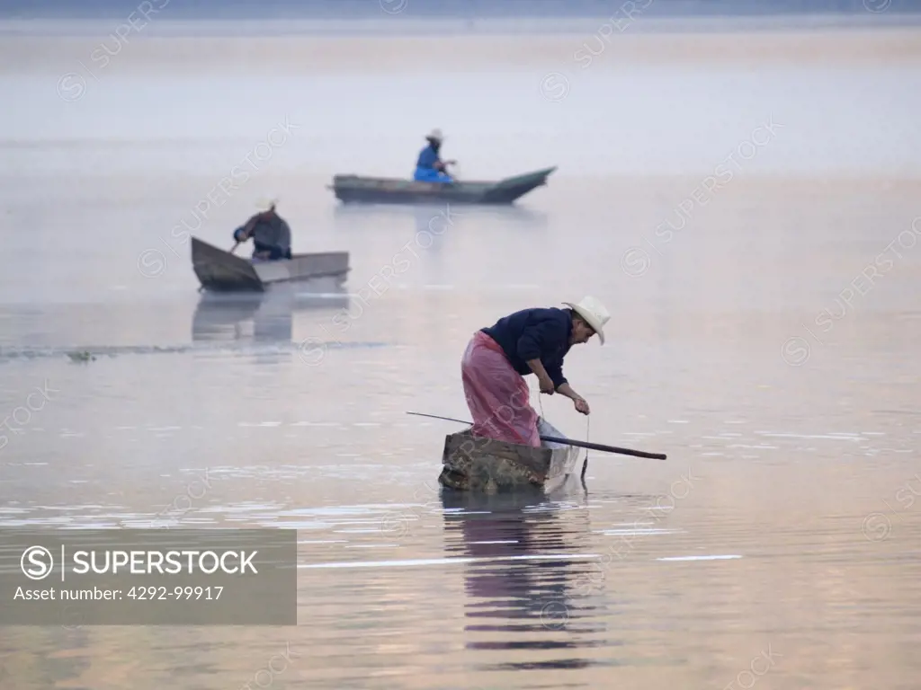 Fishermen at work on Lake Atitlan in Santiago Atitlan, Guatemala