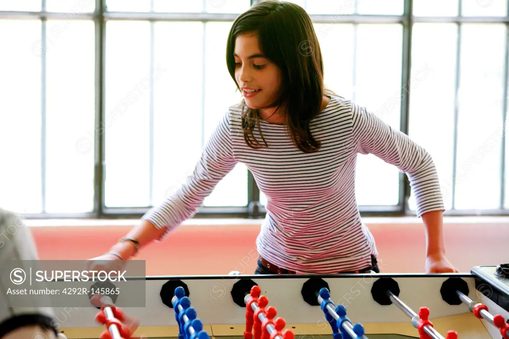 Girl playing table football