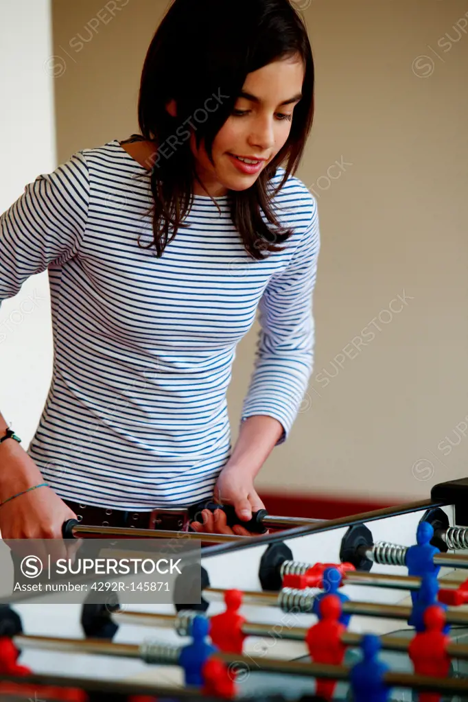 Girl playing table football
