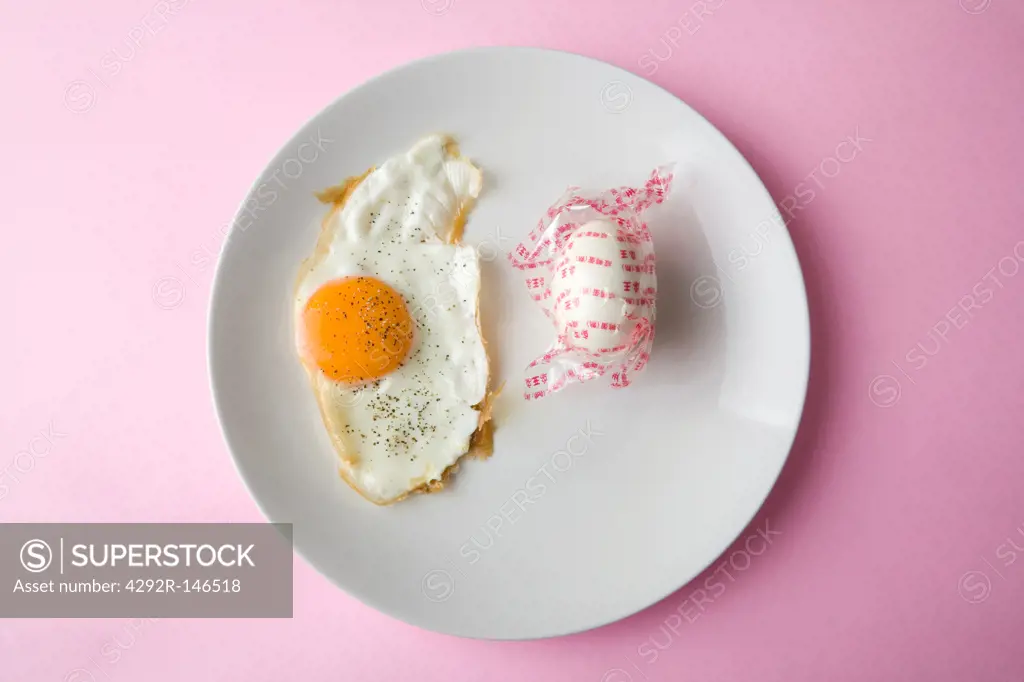 Fried egg and whole egg wrapped in plastic