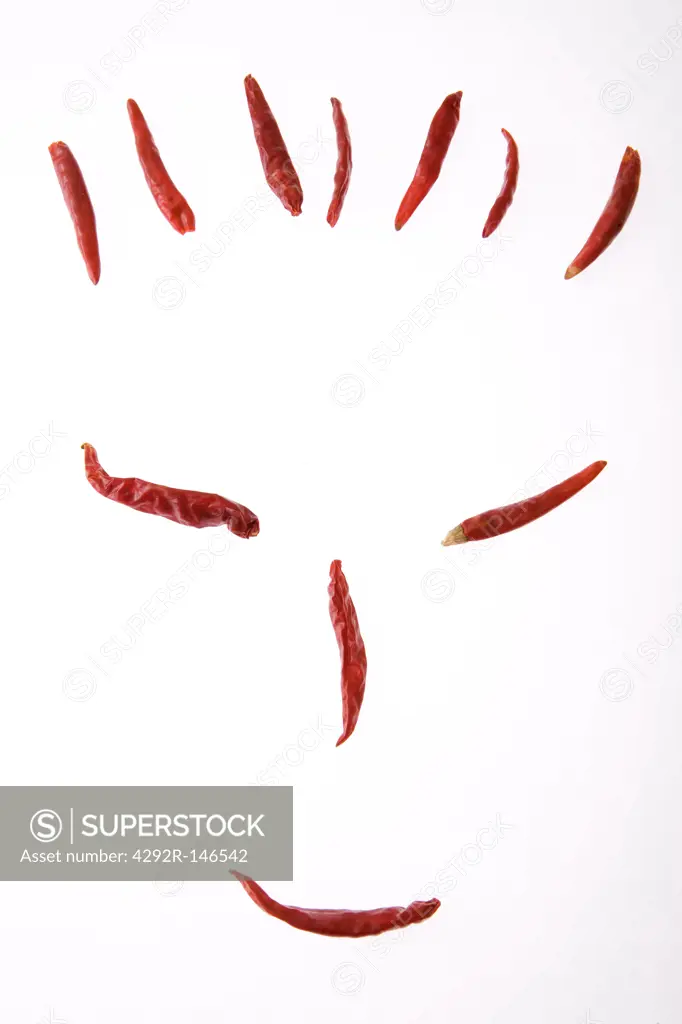 Smiley face made of red hot chili peppers