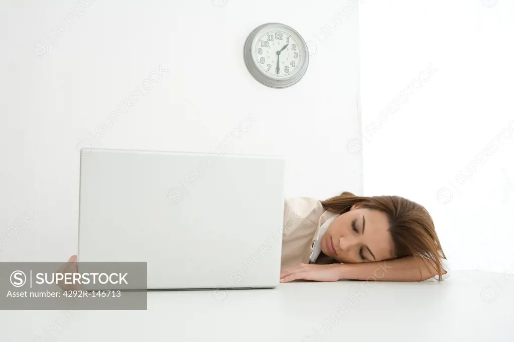 Stressed woman in front of laptop
