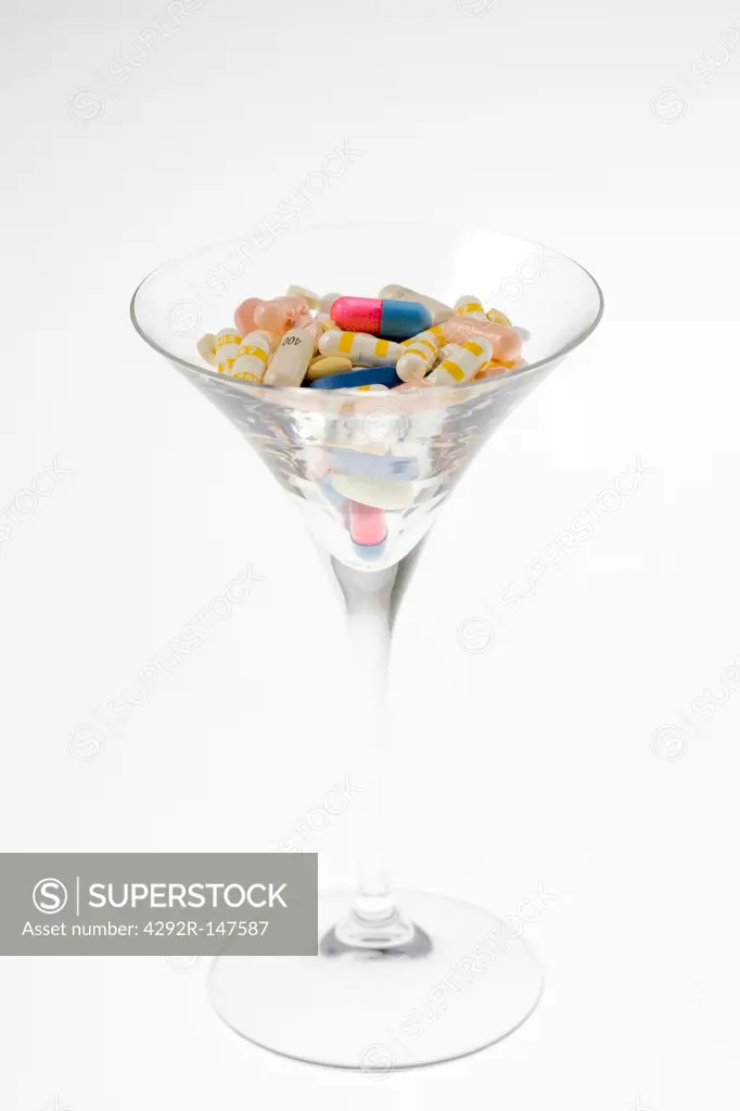 Assorted Pills in Glass