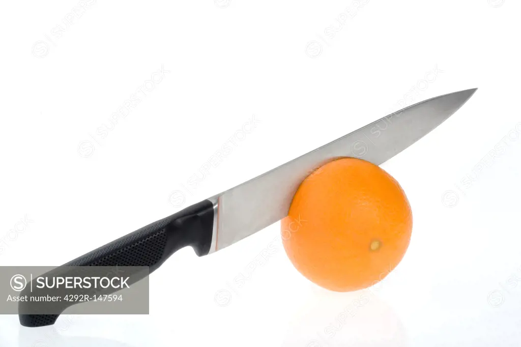 Knife cutting Oranges
