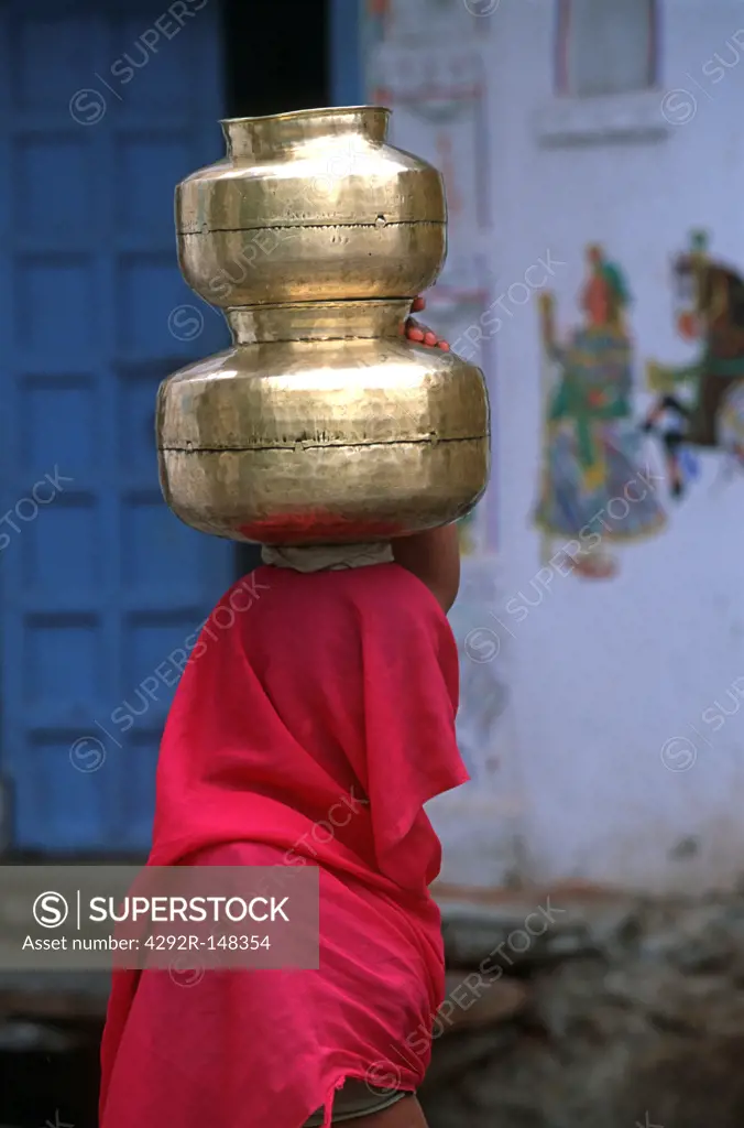 India, Rajasthan, Udaipur, woman with jars
