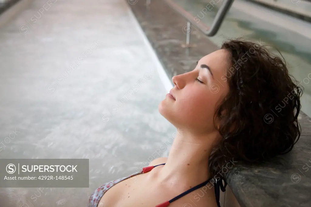 Woman at spa in thermal pool