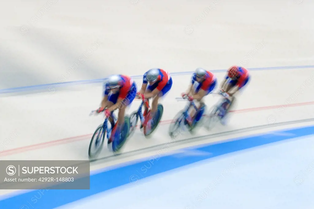 Cyclists racing on the velodrome track