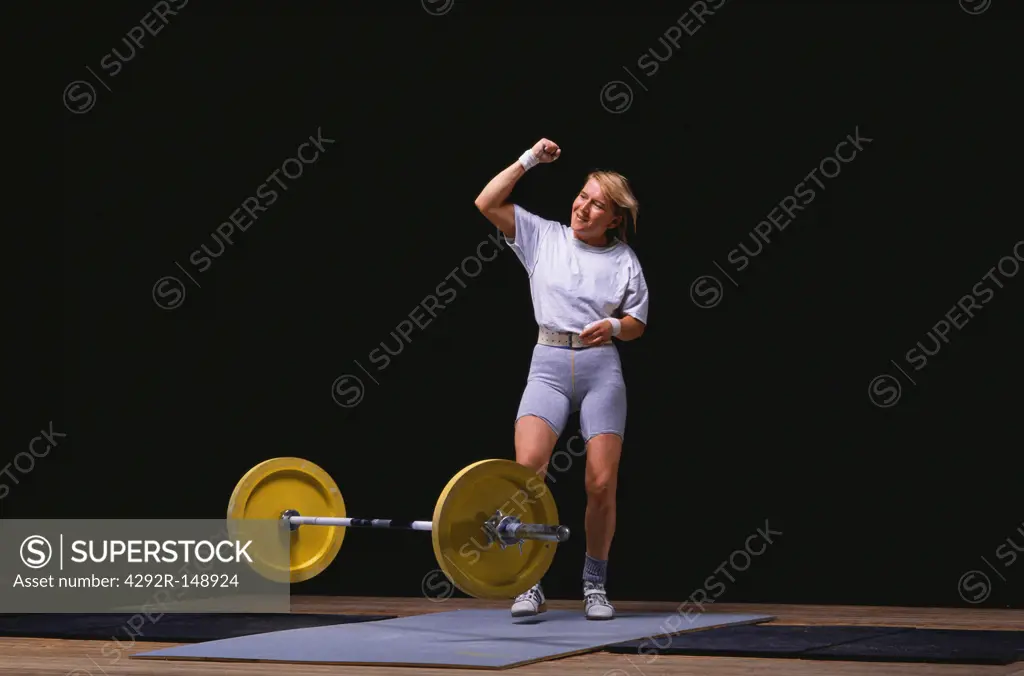 Female weighlifter celebrating after competition