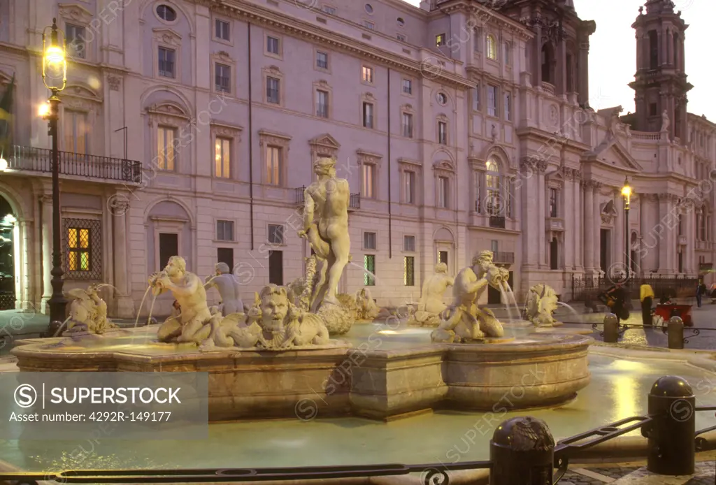 Italy, Lazio, Rome, Piazza Navona, Fountain of Neptune at dusk