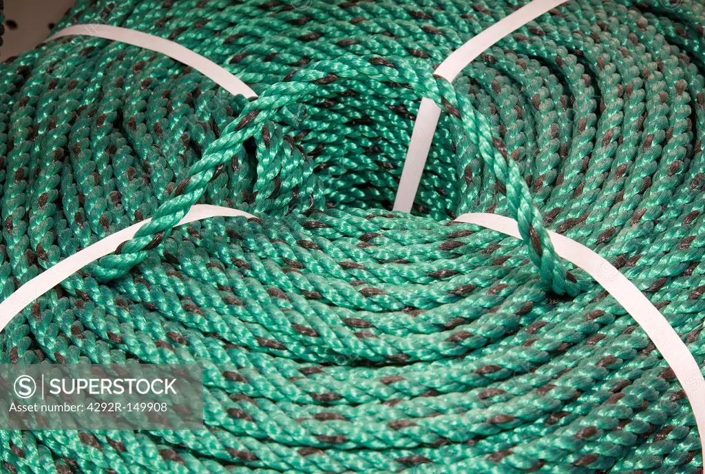 A spool of braided green polypropylene line for sale in a marine supply store