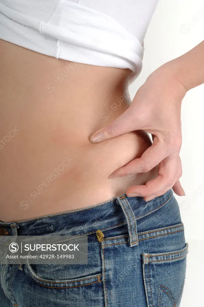 Woman pinching waist