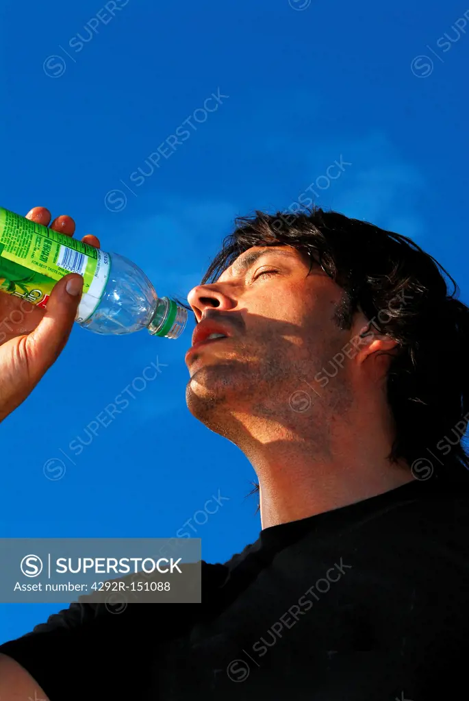 Man drinking from bottle