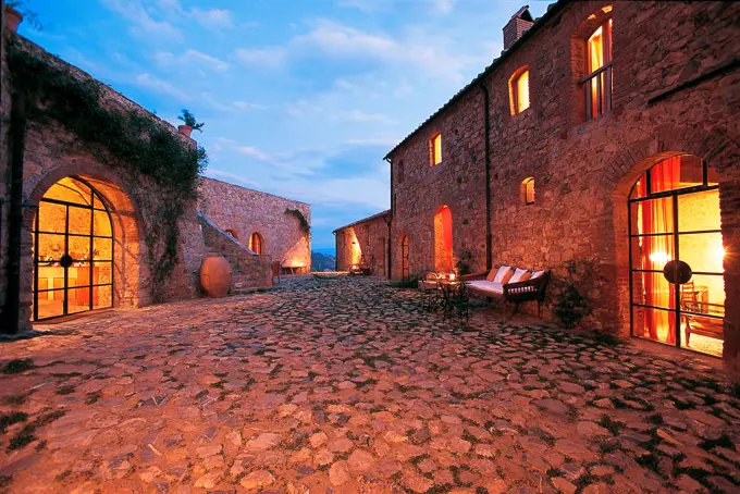 Italy, Tuscany, Cinigiano, Castle of Vicarello, Charming Farm House and resort at dusk