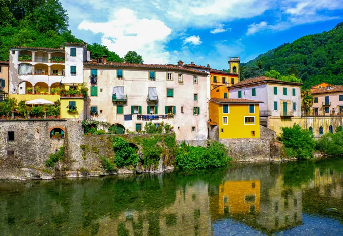 Italy, Bagni di Lucca, houses wih reflection on the Lima River