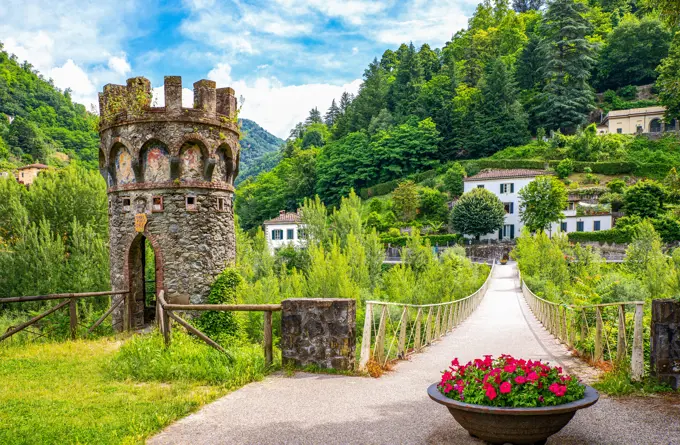 Italy, Bagni di Lucca, the little medieval tower and bridge at Villa Demidoff park,