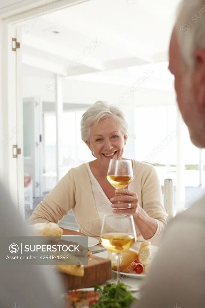 Mature woman with a glass of wine