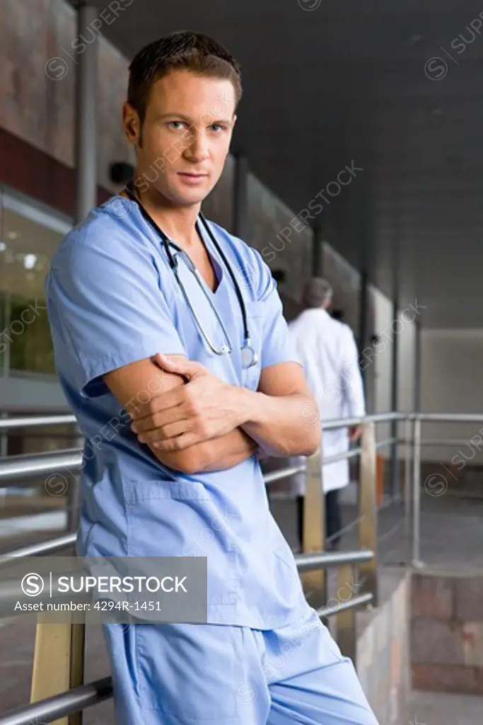Young doctor with arms crossed