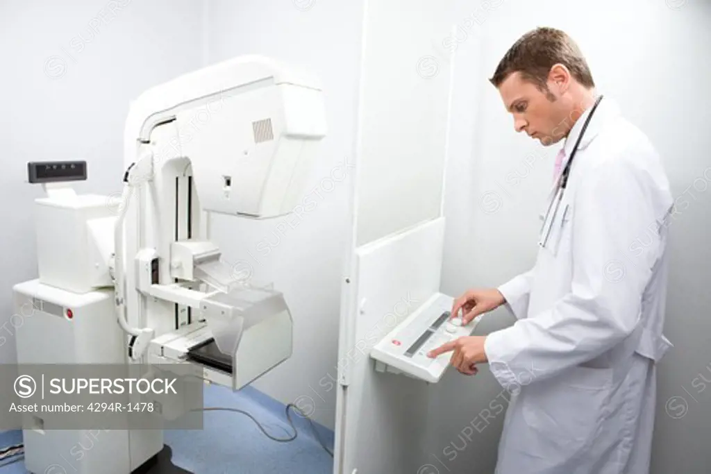 Doctor with mammography equipment