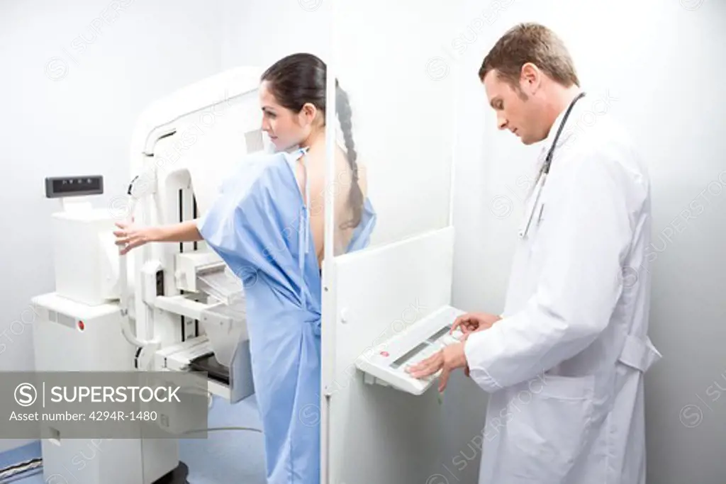 Doctor and patient performing a mammography