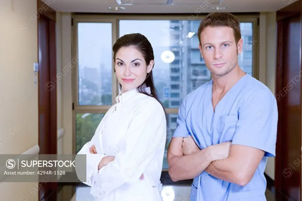 Two doctors with arms crossed