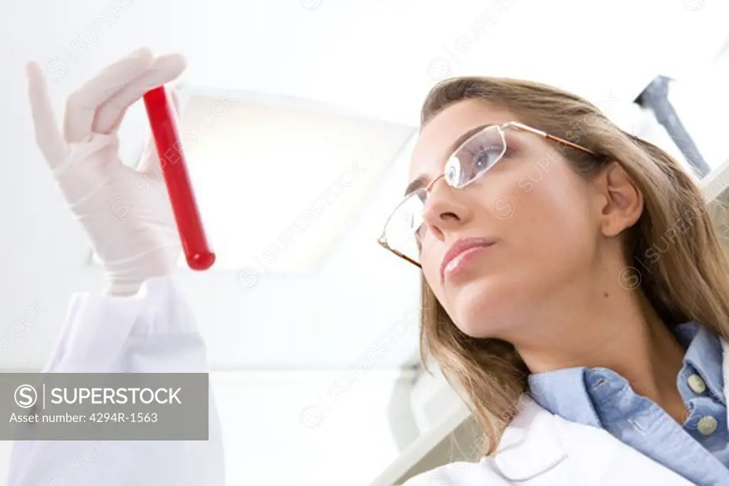 Hospital technician analyzing blood sample