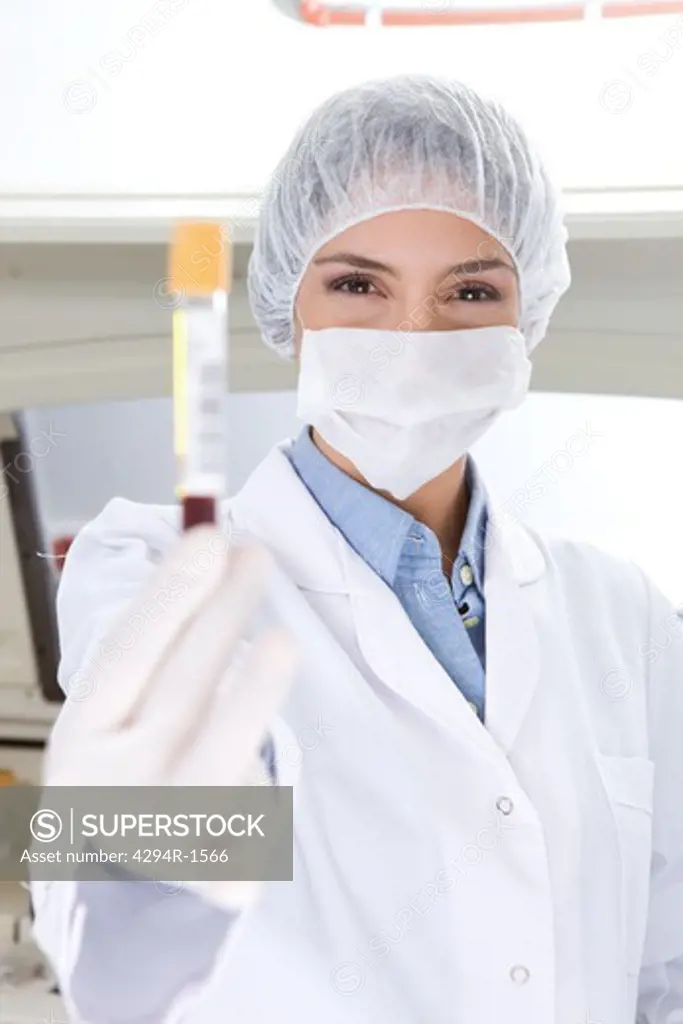 Hospital technician holding blood sample