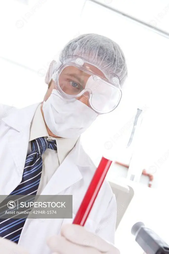 Hospital technician analyzing blood sample