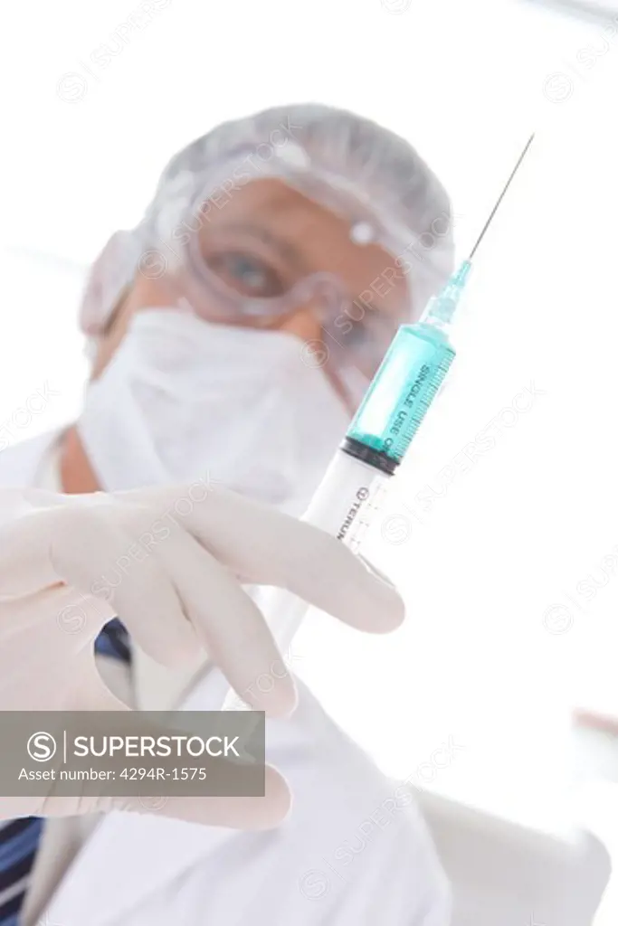 Hospital technician with a syringe