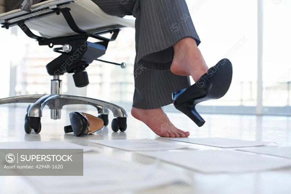 Businesswoman sitting in office chair