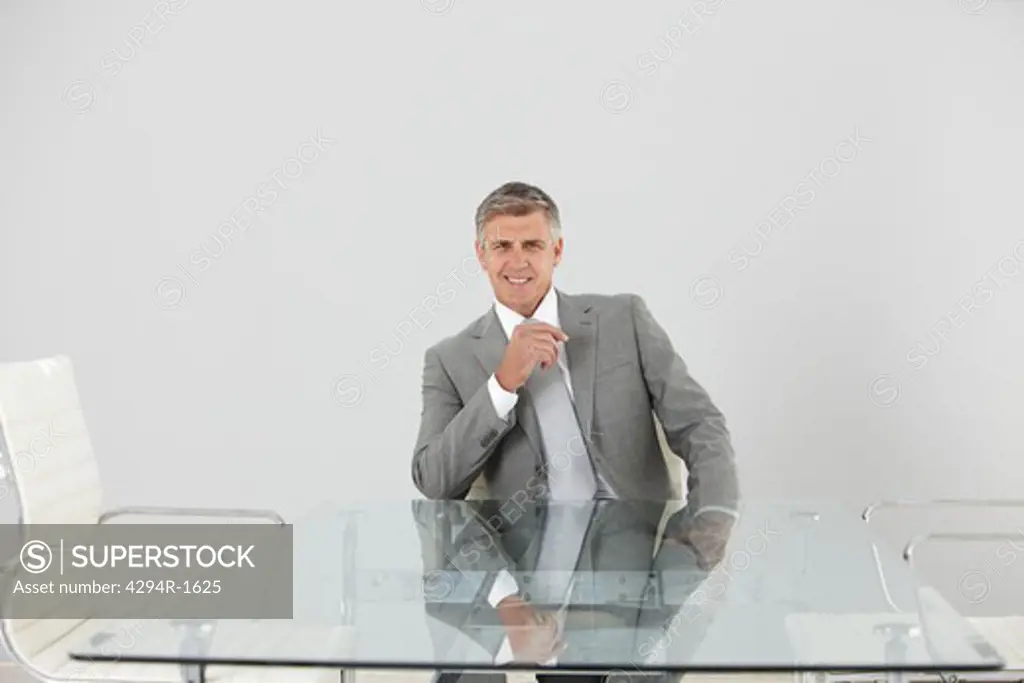 Confident manager at table