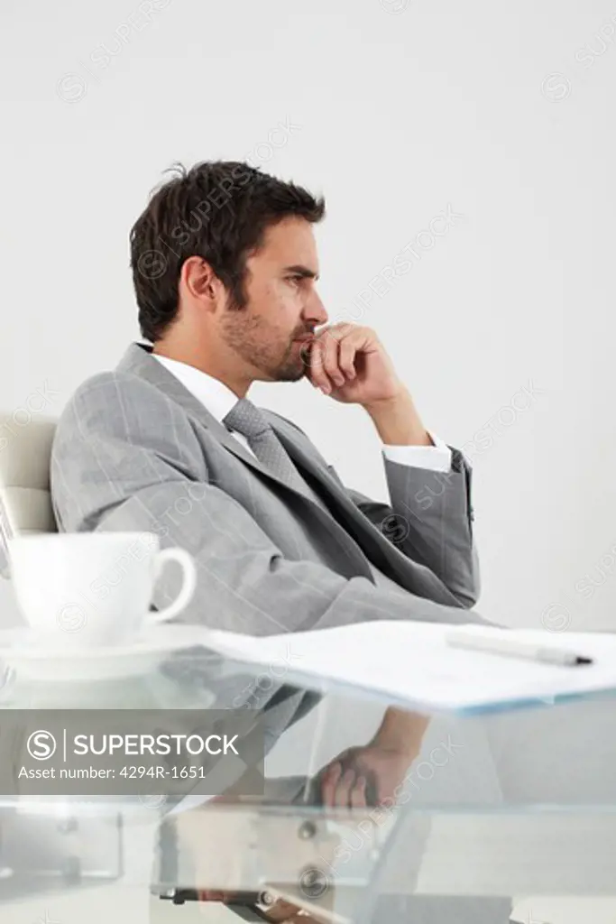 Businessman thinking at desk