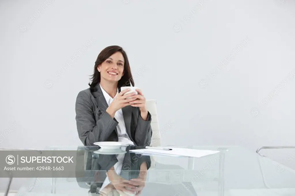 Confident businesswoman at desk